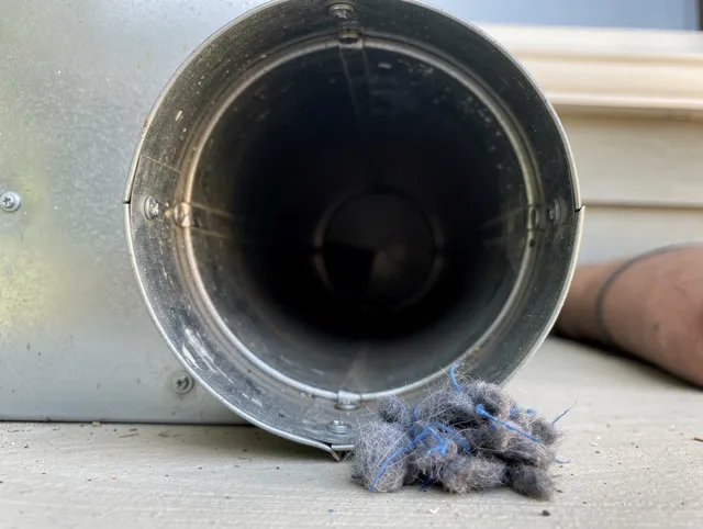 La Verne Dryer Vent Cleaning technician using specialized equipment to clear severe dryer vent blockage in La Verne